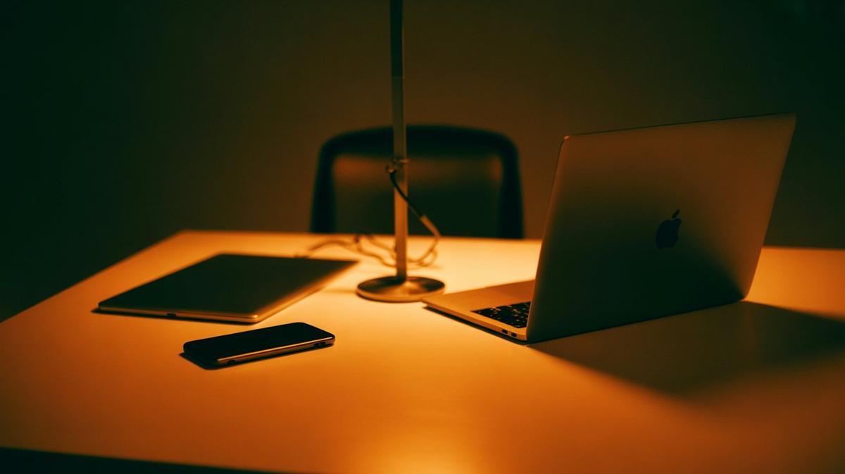 Phone, laptop and tablet linked by a warm glow
