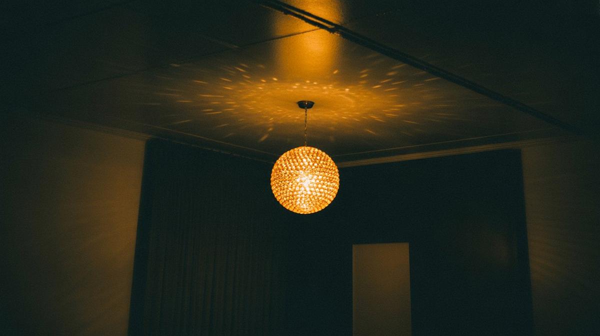 Mirror ball casting warm golden light spots